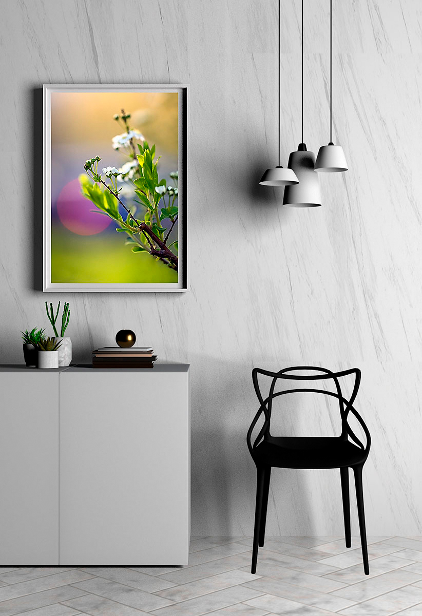 Mockup of 'Noonday Departure' in a white frame on a wall above a white sideboard with a white chair and hanging lamp.