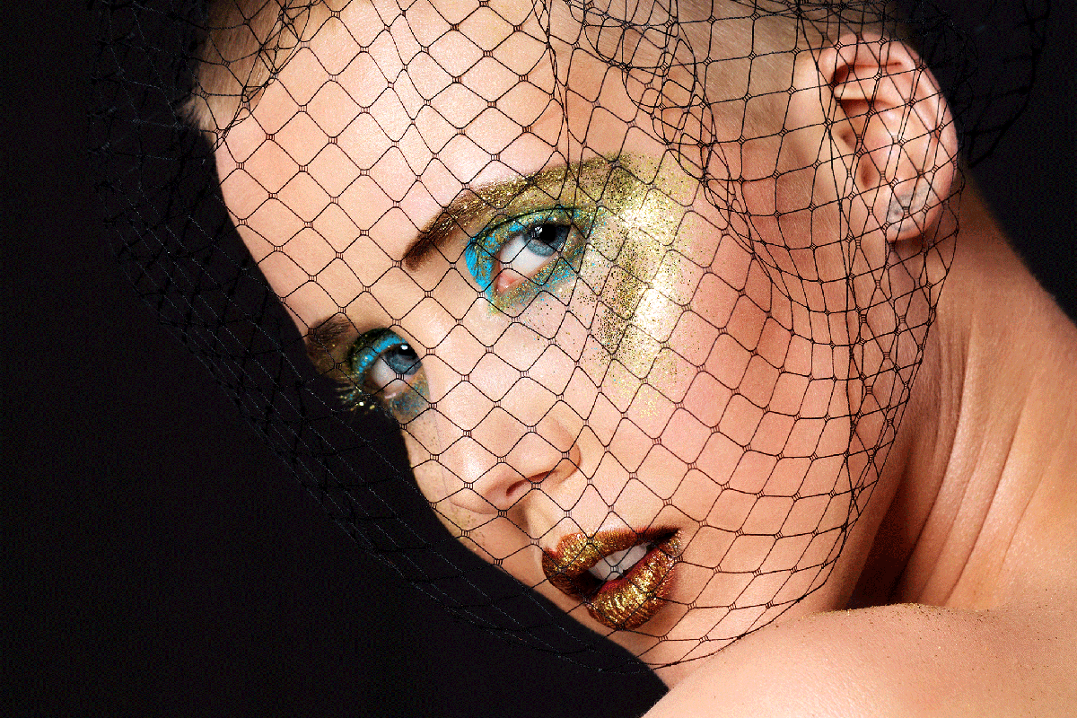 High-end make-up shoot by photographers Ralf Wittwer and Daniel Pinnow, featuring model El Fox in gold, bronze and turquoise.