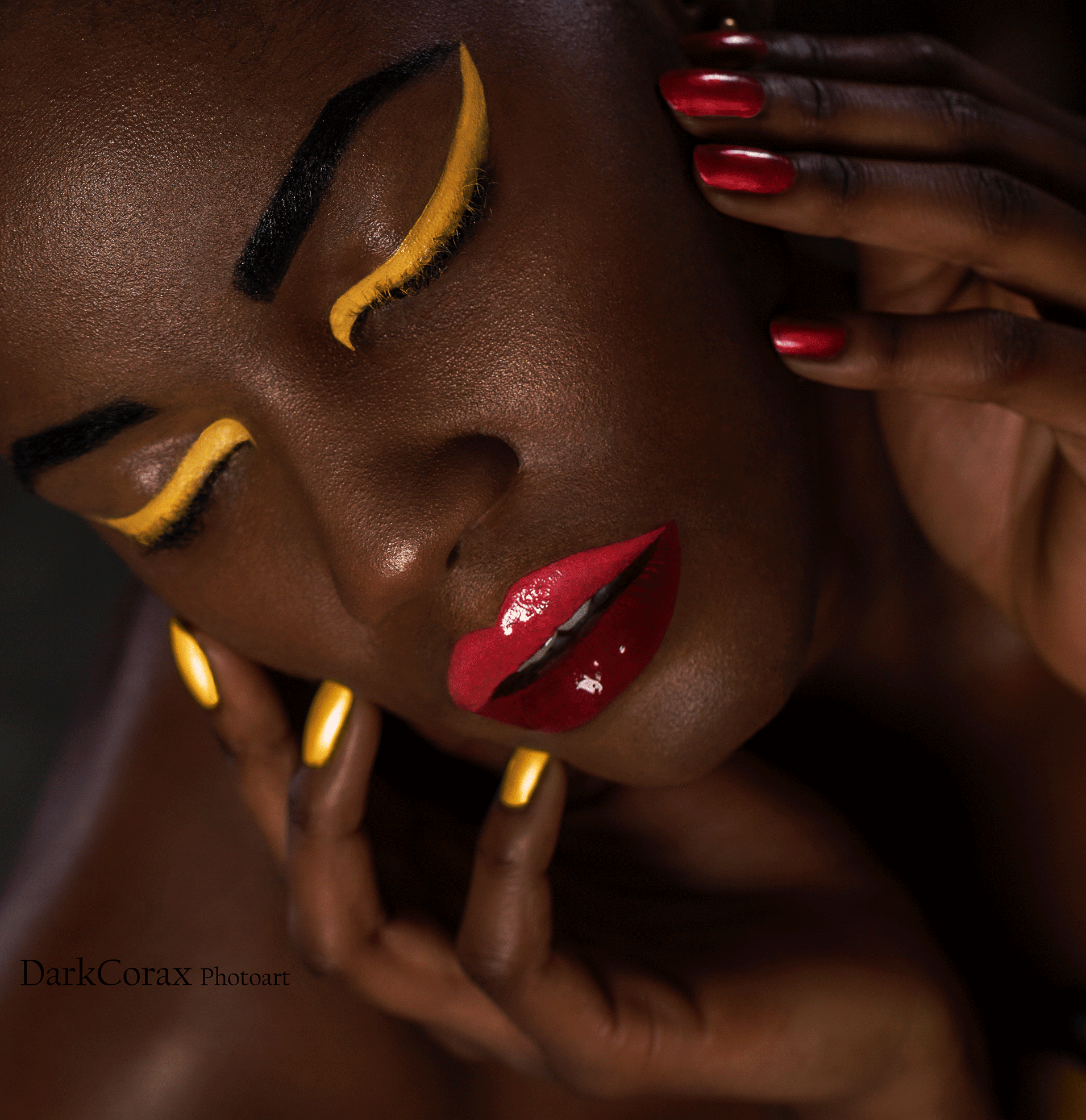 High-end makeup photoshoot featuring model Melanin Chammy adorned in luxurious golden, red, and dark red hues, captured by photographers Ralf Wittwer and Daniel Pinnow.