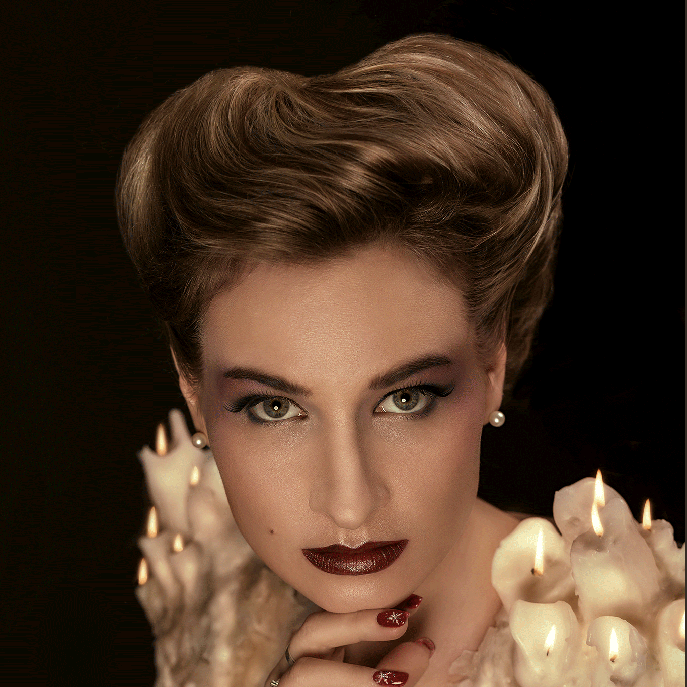A modern reinterpretation of the Gibson Girl hairstyle, featuring the model Anna Povarova with burning wax candles arranged as shoulder pads.