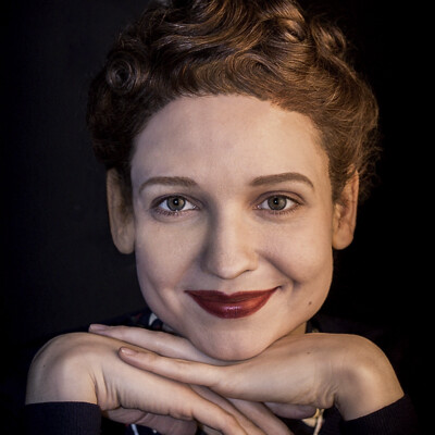 Step into the nostalgia of the 1940s with this captivating image featuring Eli S. The meticulously styled hairstyle, created with waves, curls, and papilots, perfectly complements the vintage makeup, transporting you to a bygone era of glamour and sophistication. #1940s #VintageGlamour ✨👗💄 Close-up photograph of a model with a 1940s hairstyle and vintage makeup, featuring waves, curls, and papilots. The model exudes timeless elegance, embodying the glamour of the era.