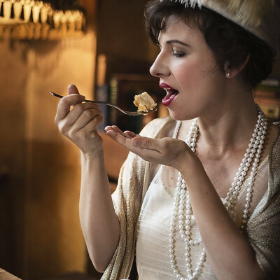 Transport yourself to the opulent world of the 1920s with Natascha Vinzenta as she channels the glamour of Gatsby's parties. With vintage elegance and Art Deco flair, this image captures the timeless allure of the Jazz Age. #GatsbyGlamour #VintageElegance #RoaringTwenties 🎩✨🍾 Vintage-inspired portrait of model Natascha Vinzenta in a glamorous 1920s ensemble against an Art Deco backdrop. She exudes sophistication and elegance, embodying the spirit of the Roaring Twenties. Photographed by Raisa Gelofre.