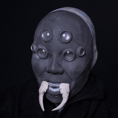 Delve into the creative journey behind Anett Alexandra Bulano's Tsuchigumo mask sculpture as it takes form, revealing the intricate details and craftsmanship behind the legendary Japanese spirit. 🕷️🎨 #SculptureInProgress #SFXArt #TsuchigumoMask Work in progress photo of a Tsuchigumo mask sculpture made from SFX clay, featuring glass eyes and spider fangs.